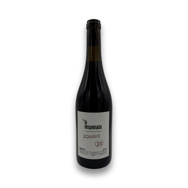 Wine bottle with a label illustrating the text 'zombie' in light purple on a white background
