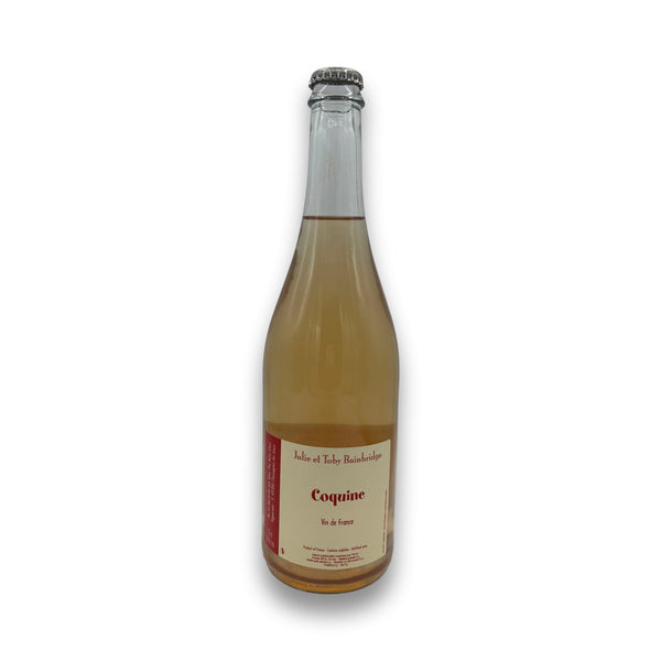 Julie et Toby Bainbridge Coquine NV French sparkling wine bottle with cream label and silver cap