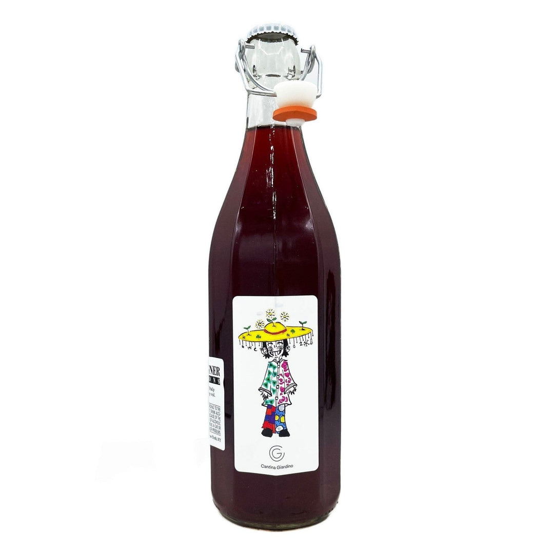 Bottle of red wine with a colorful label featuring a person in a hat on a white background