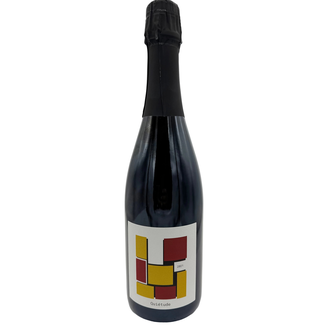 Bottle of sparkling wine with colorful red and yellow squares on it&