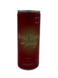 A single can of Nomadica Rosé Yuzu Spritz, featuring a deep red metallic can with gold lettering and a subtle gold gradient on the front, set against a plain white background.