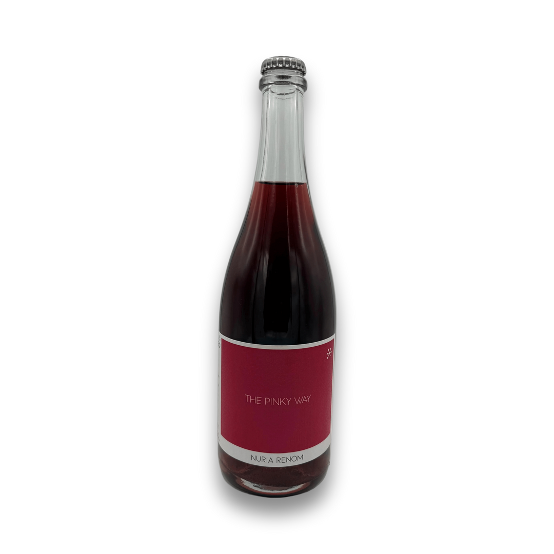Nuria Renom The Pinky Way 2023 sparkling wine bottle with deep pinkish-red liquid and matte red label