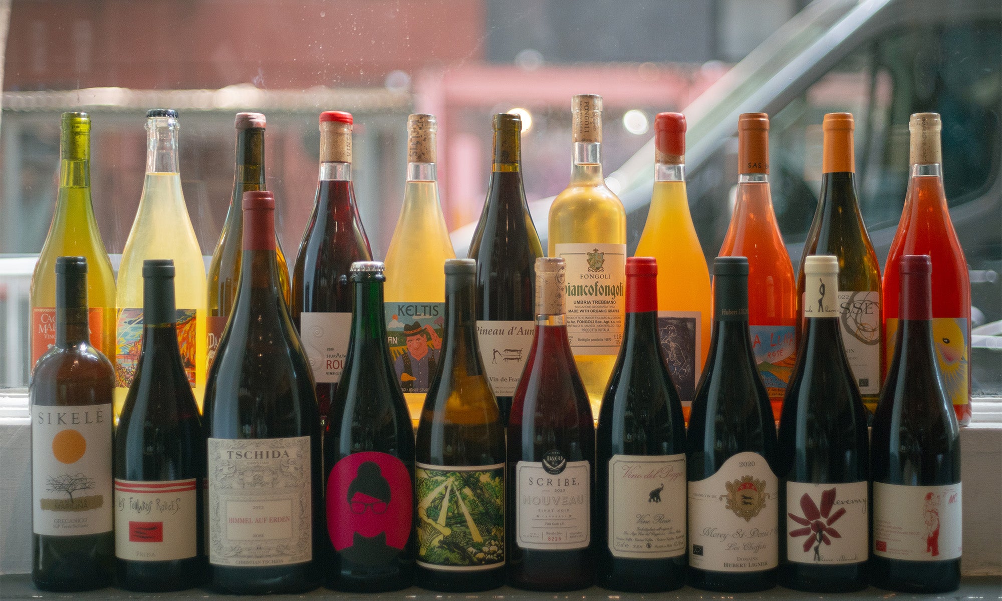 Wine bottles on windowsill 