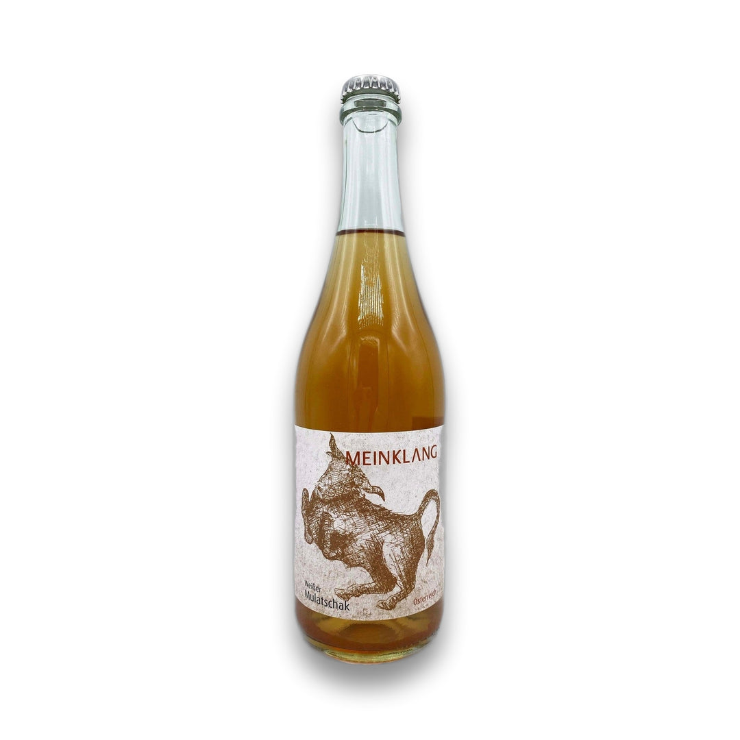 Bottle of Meinklang orange wine with a white label depicting an amber bull on a white background