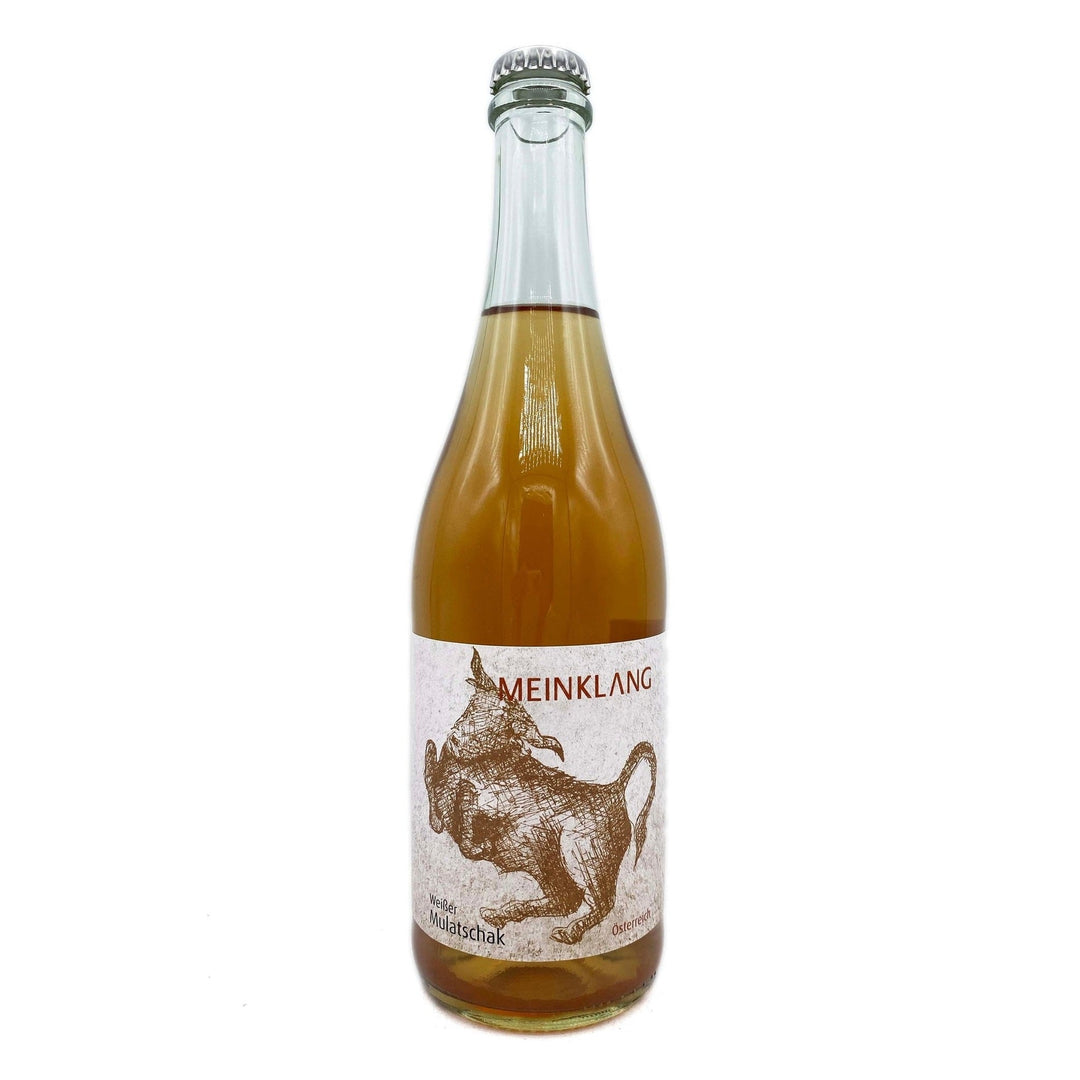 Bottle of Meinklang orange wine with a white label depicting an amber bull on a white background